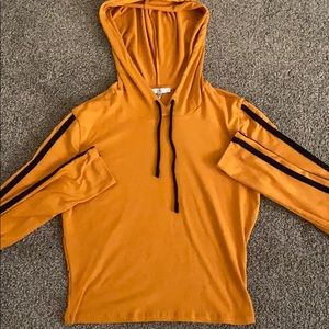 Yellow Sweater with striped on sleeves.